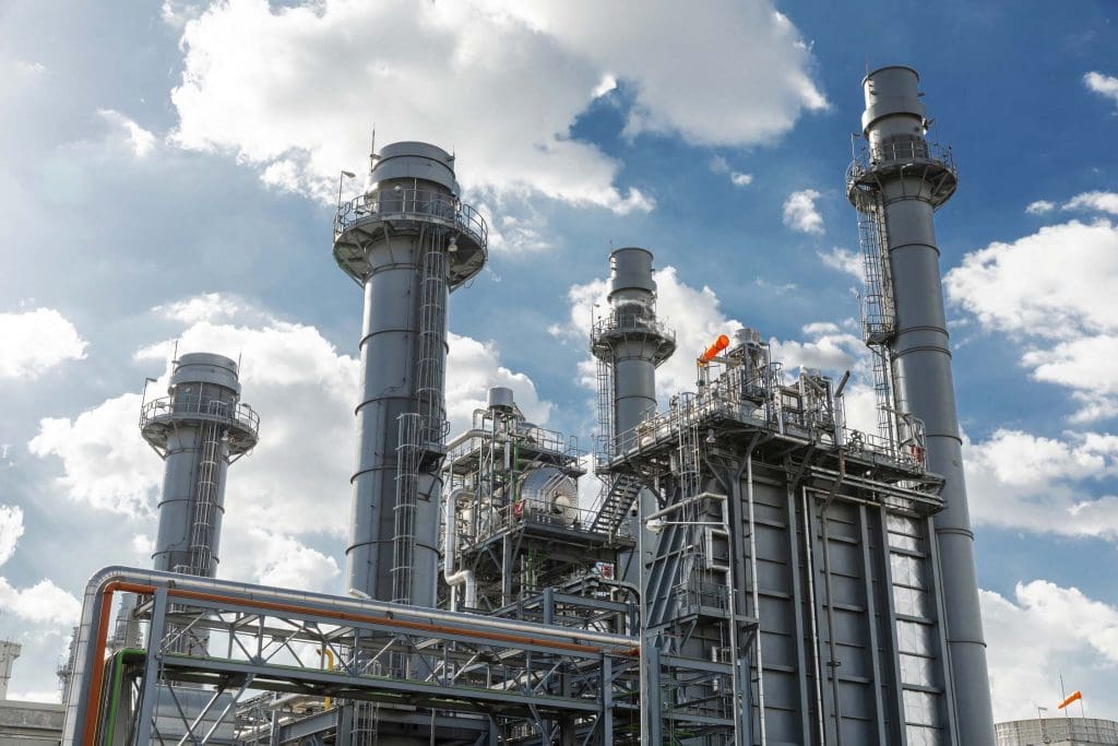 Industrial plant with exhaust stacks and pipes, ready for ResponsAble turnaround staffing.