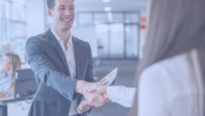 Job candidate shaking hands with an interviewer, preparing for a successful job interview at ResponsAble Staffing.
