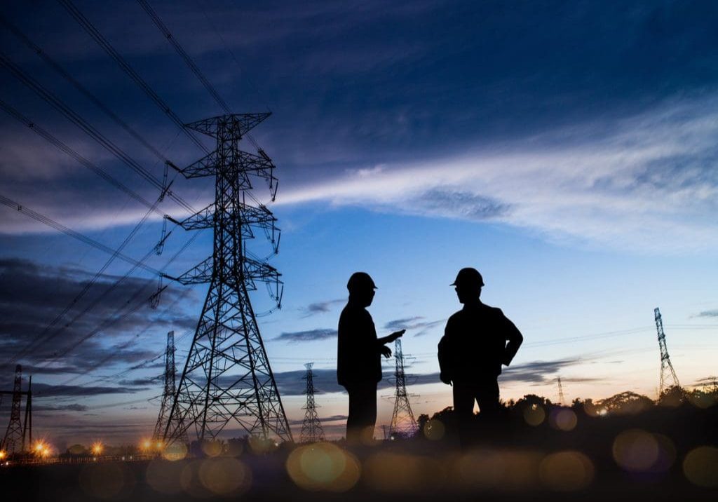 Silhouette of engineer and construction team working at site over blurred background for industry background with Light fair and bokeh. Create from multiple reference images together.