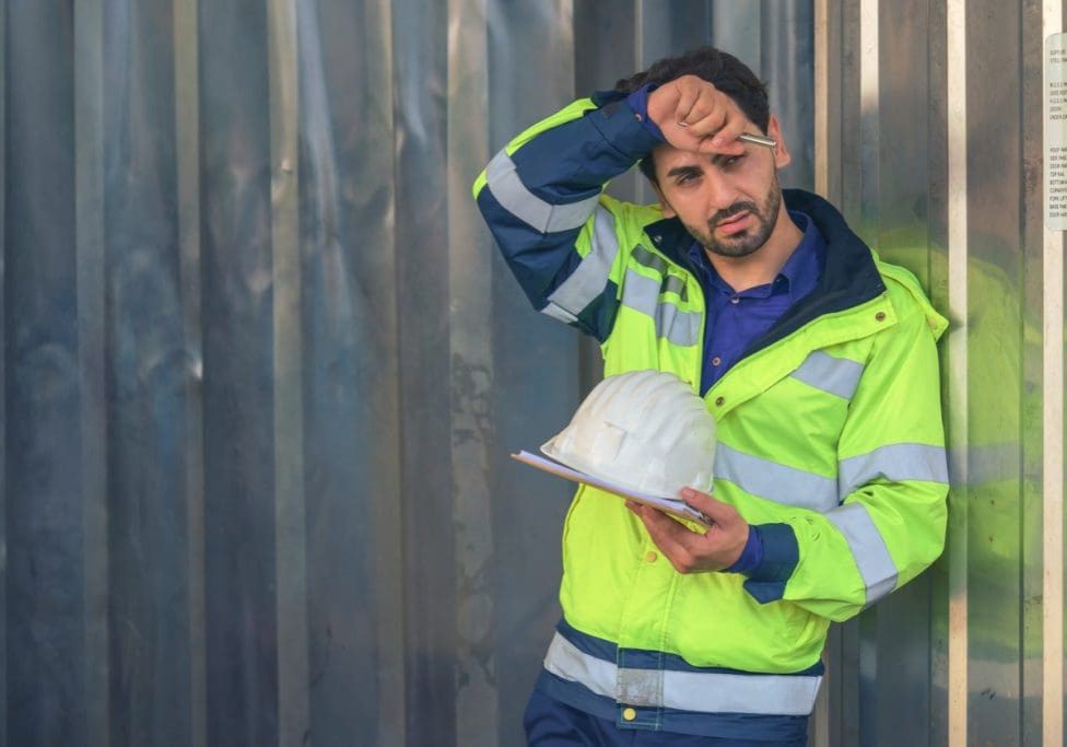 portrait of factory warehouse supervisor in front of tempurature control container