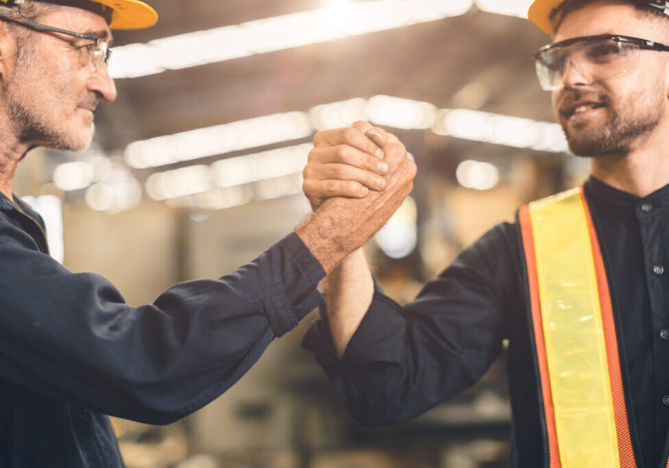 young engineer with senior team work happy joint hand force cooperate power working together